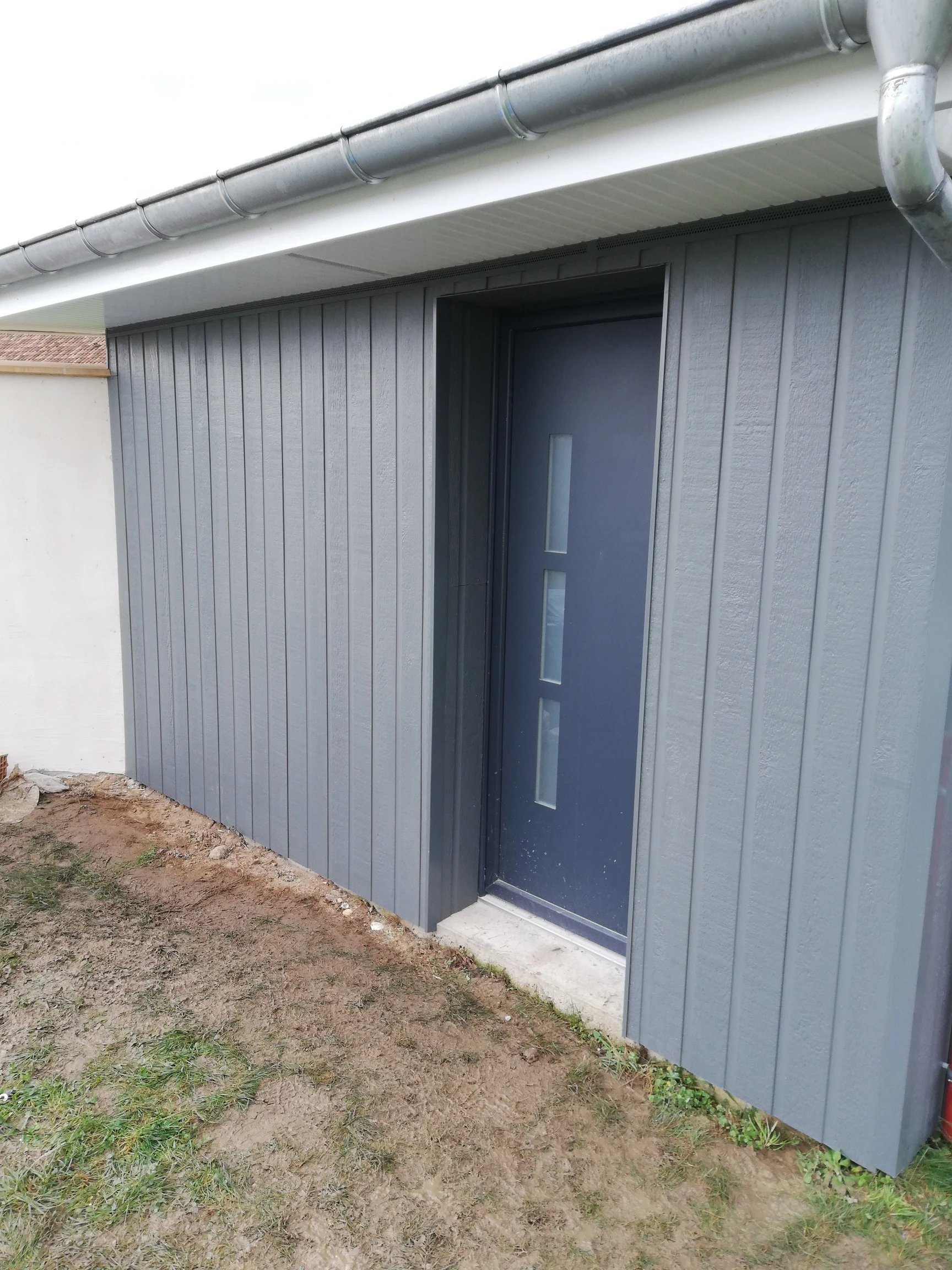 Pose de bardage composite