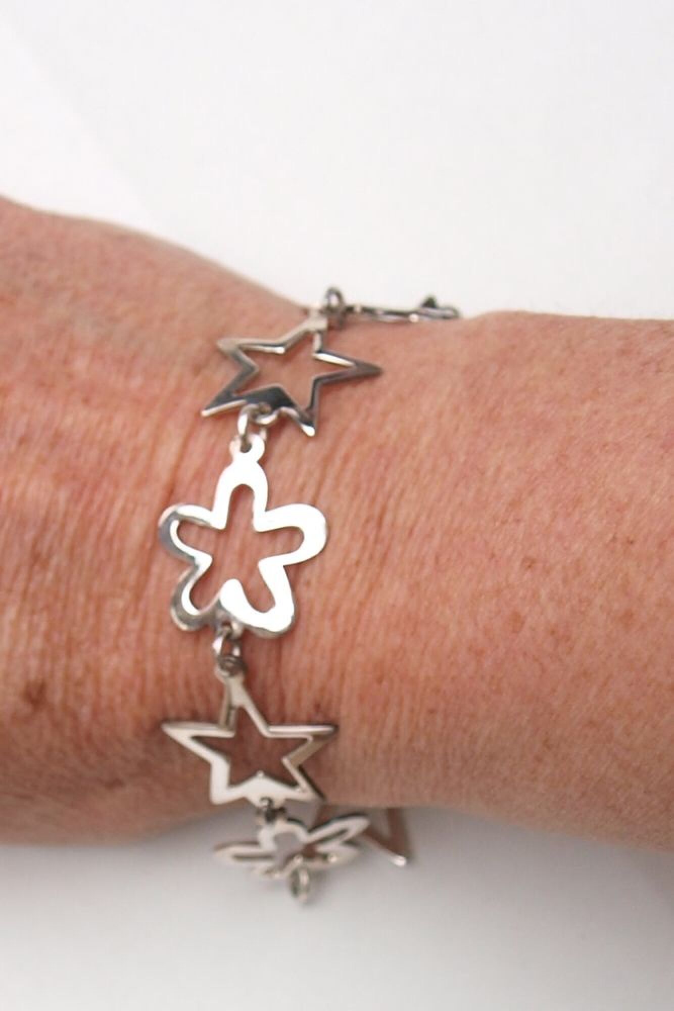 Bracelet en argent étoiles et fleurs