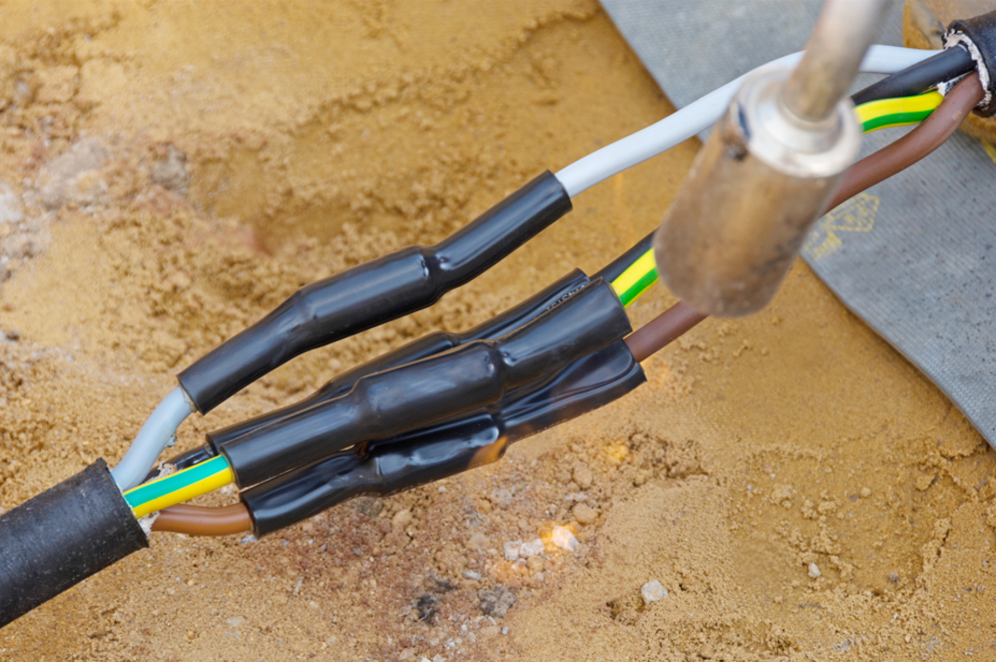 Pose de gaine thermorétractable